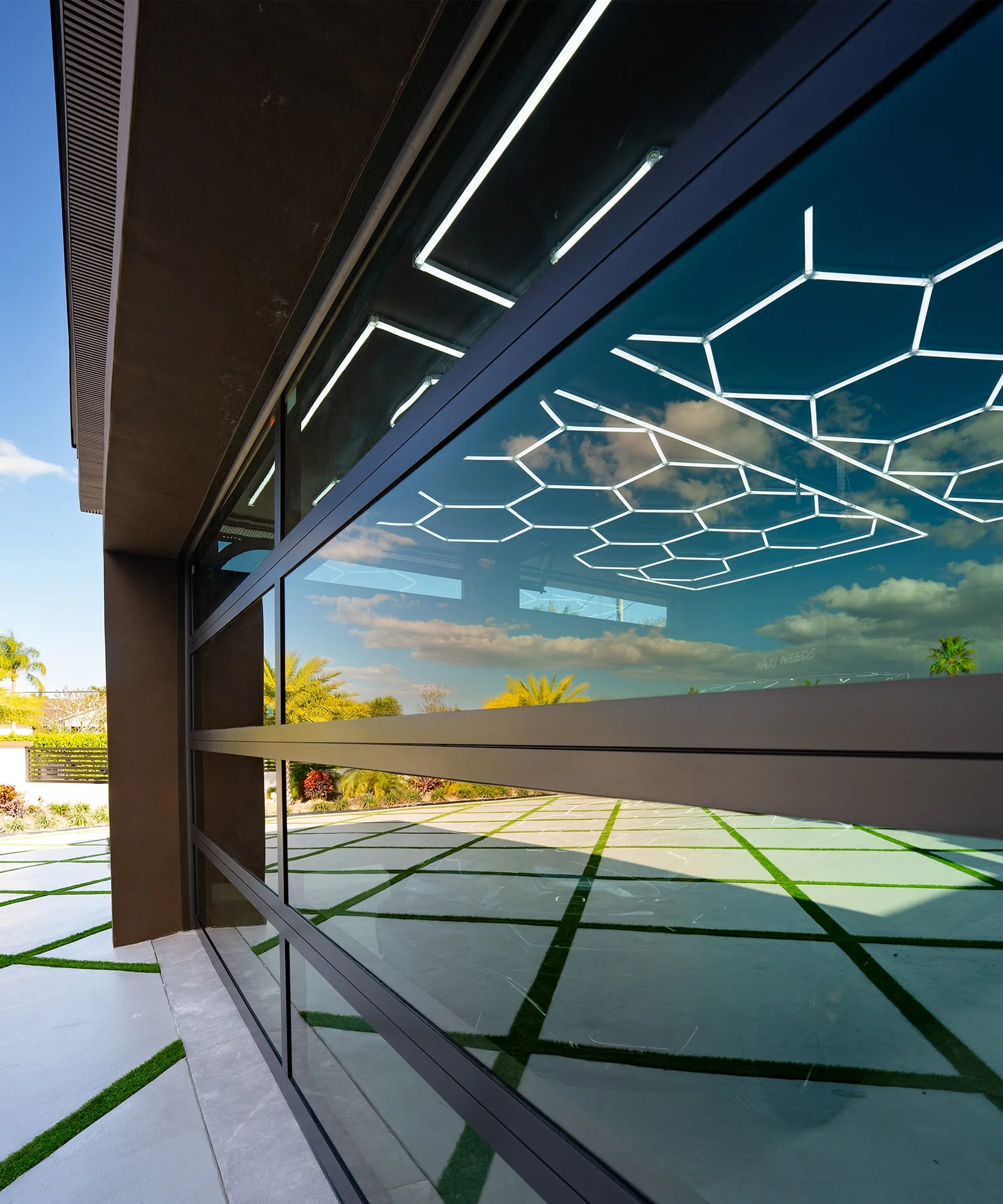 Close view of an All Glass Garage dark-framed glass garage door